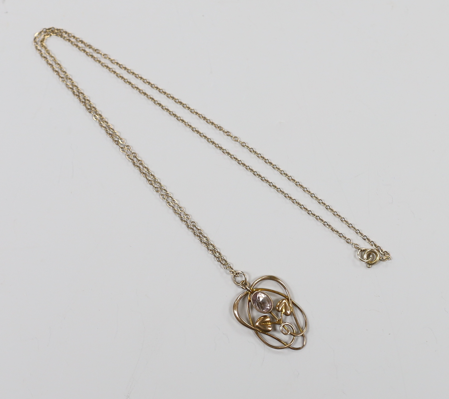 An Edwardian Art Nouveau 9ct and pale amethyst set pendant, on a 9ct chain, overall 52cm, gross weight 3.1 grams.